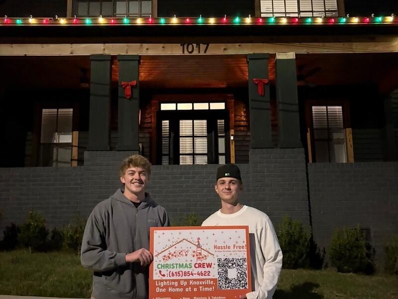 Rocky Top Christmas Crew founders holding company sign